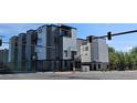 Modern townhomes feature a striking gray and white exterior with street access and top floor balconies at 1416 Pierce St, Lakewood, CO 80214