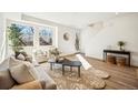 Inviting living room with large windows, elegant furnishings, and contemporary design at 1416 Pierce St, Lakewood, CO 80214