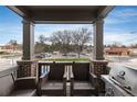 View of the balcony area showcasing outdoor seating furniture and a barbecue grill at 1312 Independence St # 3, Lakewood, CO 80215