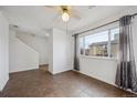 Bright living room with tile floors and view at 906 S Peoria St, Aurora, CO 80012