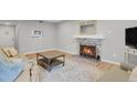 Cozy living room featuring a fireplace and comfortable seating arrangement at 3872 S Fraser St # O03, Aurora, CO 80014