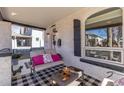 Cozy front porch with comfortable seating and view of the front yard at 858 S Emerson St, Denver, CO 80209