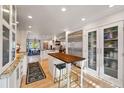 Bright, updated kitchen with stainless steel appliances and a spacious island with barstool seating at 4074 S Poplar Way, Denver, CO 80237