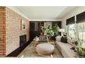 Stylish living room featuring a brick fireplace and comfortable seating at 2060 Kline St, Lakewood, CO 80215