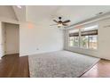 Spacious main bedroom with large windows offering natural light, plush carpet, and hardwood flooring at 12993 E 108Th Ave, Commerce City, CO 80022