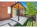 Backyard patio with pergola over the concrete area, perfect for outdoor relaxing at 1691 W 66Th Ave, Denver, CO 80221