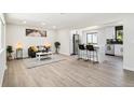 Open-concept living area with seamless transition to the kitchen for an amazing entertainment space at 2767 W Iliff Ave # 1, Denver, CO 80219