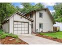 Charming two-story home with a two-car garage and well-maintained landscaping at 32 Powder Horn Pl, Longmont, CO 80504
