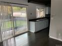 Charming kitchen featuring dark countertops, light blue cabinets and stainless steel sink at 865 S Depew St, Lakewood, CO 80226
