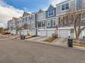 Street view of well-kept townhomes showcasing their appealing curb appeal and consistent architectural style at 1699 S Trenton St # 172, Denver, CO 80231