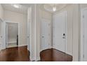 Bright entryway featuring hardwood floors, white trim, and recessed lighting at 303 Inverness Way # 201, Englewood, CO 80112