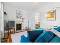 Inviting living room features a decorative fireplace and comfortable seating arrangement at 1038 E 4Th Ave, Denver, CO 80218