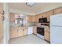 Well-lit kitchen with ample cabinetry and counter space at 6712 E Briarwood Dr, Centennial, CO 80112