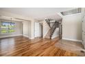 Inviting foyer with hardwood floors and staircase at 1076 Switch Grass Dr, Castle Rock, CO 80109