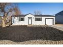 Charming single-story home with a well-maintained front yard and attached single car garage at 10792 Moore St, Broomfield, CO 80021