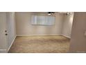 This bedroom features neutral walls, carpet flooring, ceiling fan and horizontal blinds at 12170 Huron St # 106, Denver, CO 80234
