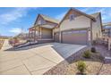 Well-maintained home with a spacious driveway and manicured landscaping at 7884 Blue River Ave, Littleton, CO 80125