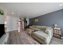 Cozy living room with a comfortable sectional sofa, stylish rug, and modern decor accents at 10321 W 59Th Ave # 2, Arvada, CO 80004