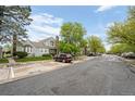Street view showcases well-maintained townhomes, landscaping, and convenient parking at 4020 E 94Th Ave # B, Thornton, CO 80229