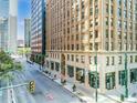 Street-level view of an elegant brick and concrete building in an urban neighborhood with a view of adjacent buildings at 444 17Th St # 807, Denver, CO 80202