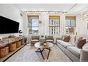 Cozy living room with large windows, stylish furnishings, and a view of the city at 444 17Th St # 807, Denver, CO 80202