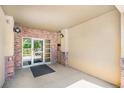 Apartment building entrance with brick accents and a secure glass door for residents at 1044 Rockhurst Dr # 207, Highlands Ranch, CO 80129