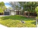 Inviting single Gathering home showcasing a well-maintained front yard, mature trees, and a two-car garage at 11524 Marshall Ct, Broomfield, CO 80020