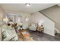 Sun-filled living room featuring sleek floors, neutral tones, and modern furnishings at 4720 S Bannock St, Englewood, CO 80110