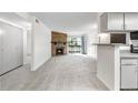 Spacious living area boasting stone fireplace, sliding glass doors to the balcony and neutral carpet at 1758 S Pitkin Cir # A, Aurora, CO 80017