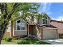 Charming home featuring a blend of brick and siding, complemented by well-maintained landscaping at 8555 Angela Ln, Parker, CO 80134