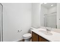 Bathroom featuring a vanity with white countertop and walk-in shower at 4590 Boone Cir, Brighton, CO 80601