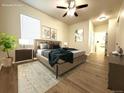 Serene primary bedroom with a large bed, neutral tones, and ample natural light at 4451 S Ammons St # 108, Littleton, CO 80123
