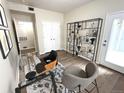 Bright and airy office space with a glass desk, stylish seating, and modern decor at 4451 S Ammons St # 108, Littleton, CO 80123