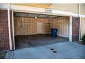 A large two-car garage with lots of shelving and organization, providing convenience and functionality at 16180 E Geddes Ln # 14, Aurora, CO 80016