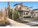 Modern home with a landscaped yard and walkway at 1860 W 68Th Ave, Denver, CO 80221