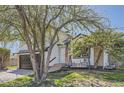Lovely exterior view featuring a porch swing, mature trees, and well-maintained landscaping at 690 Howe Ct, Castle Rock, CO 80104