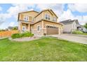 Charming two-story home with a well-manicured lawn, a large garage, and beautiful stone accents at 3762 White Rose Loop, Castle Rock, CO 80108