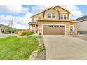 Charming two-story home with a well-manicured lawn and attached two car garage at 3762 White Rose Loop, Castle Rock, CO 80108