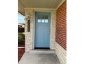 Blue front door with a modern house number sign at 3608 N Grape St, Denver, CO 80207