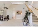Open-concept living space with a dining area, staircase, and pass-through to the kitchen at 3260 47Th St # 201A, Boulder, CO 80301
