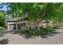 Attached three-car garage with paver driveway at 5831 S Albion Ct, Greenwood Village, CO 80121