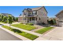 Attractive home featuring a well-maintained lawn and landscaping at 22268 E Hidden Trail Dr, Parker, CO 80138