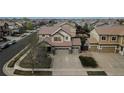 A charming two-story home with a three-car garage and well-manicured landscaping at 15523 E 117Th Ave, Commerce City, CO 80022