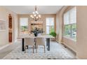 An inviting dining room with ample natural light, stylish decor, and comfortable seating at 3143 Elmira St, Denver, CO 80238