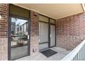 Brick building exterior with entrance and street view at 3872 S Dallas St # 7-101, Aurora, CO 80014