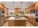 Gourmet kitchen with granite countertops, stainless steel appliances, and a functional center island at 2290 S Braun Way, Lakewood, CO 80228