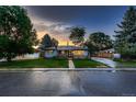 Charming ranch home with a well-manicured lawn and updated curb appeal at 4995 E Atlantic Pl, Denver, CO 80222