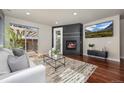 Bright living room with fireplace, backyard access and sleek modern finishes at 2053 Meade St, Denver, CO 80211