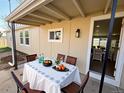 Covered patio features an outdoor dining area, perfect for entertaining guests at 9036 Mandel St, Denver, CO 80260