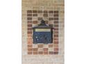 Close-up of a unique mailbox with intricate details and a vintage aesthetic at 1355 Hudson St, Denver, CO 80220